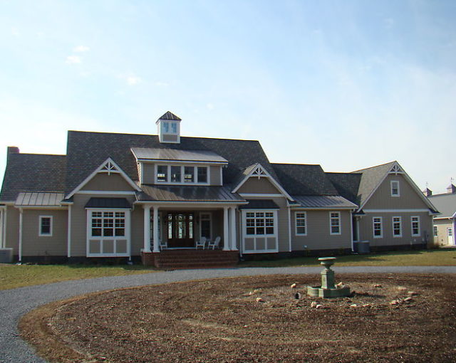 shingles on large tan home