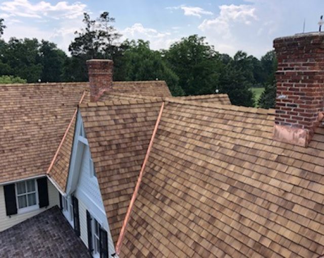 Cedar shakes installed with copper flashing for rain