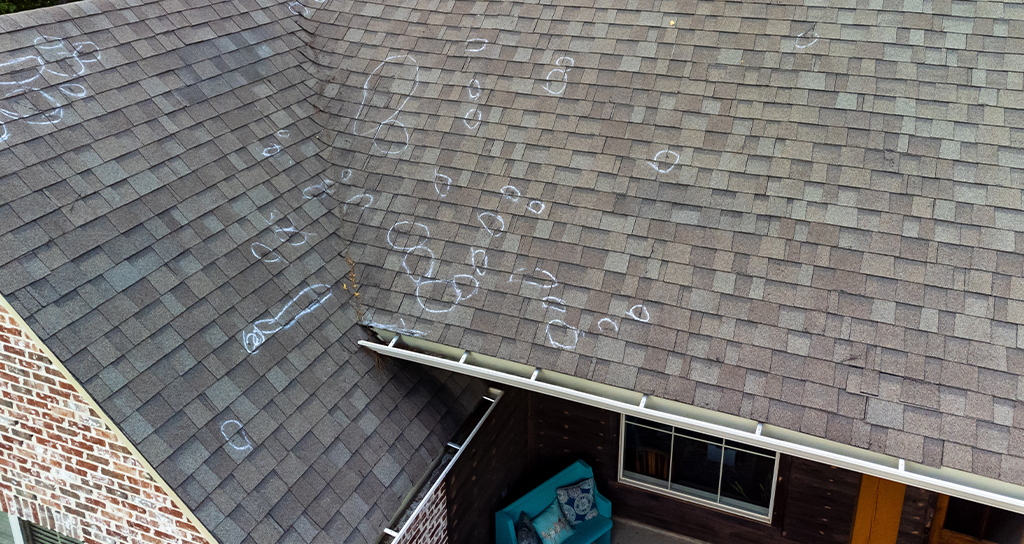 roof inspected after hail damage for insurance claim