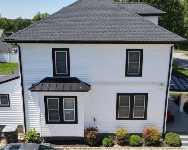 home roof restoration project with asphalt shingles