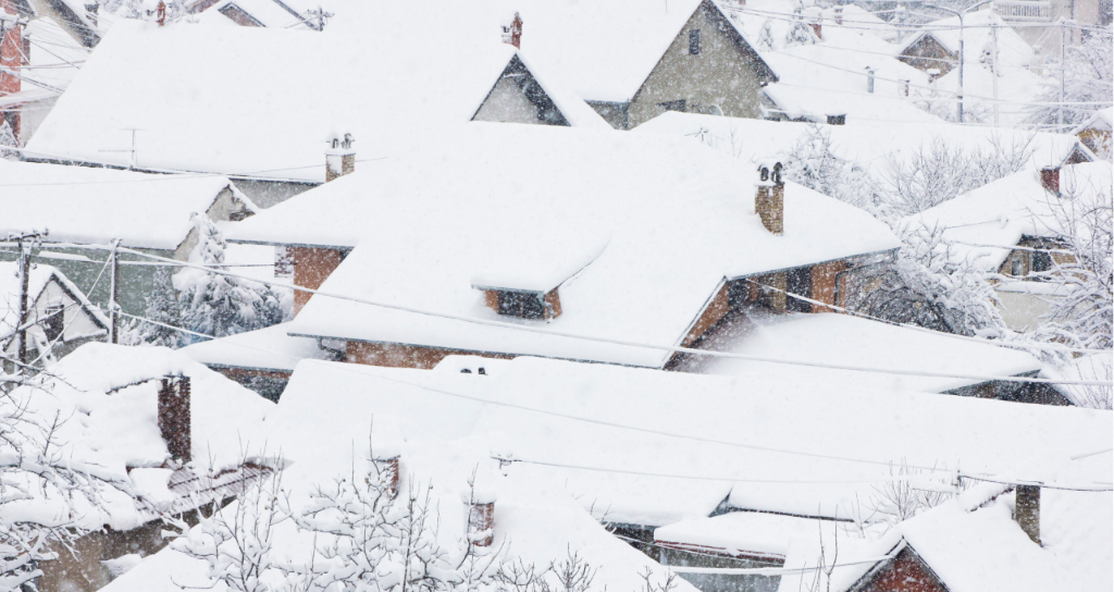 what causes ice dams with snow covered roofs